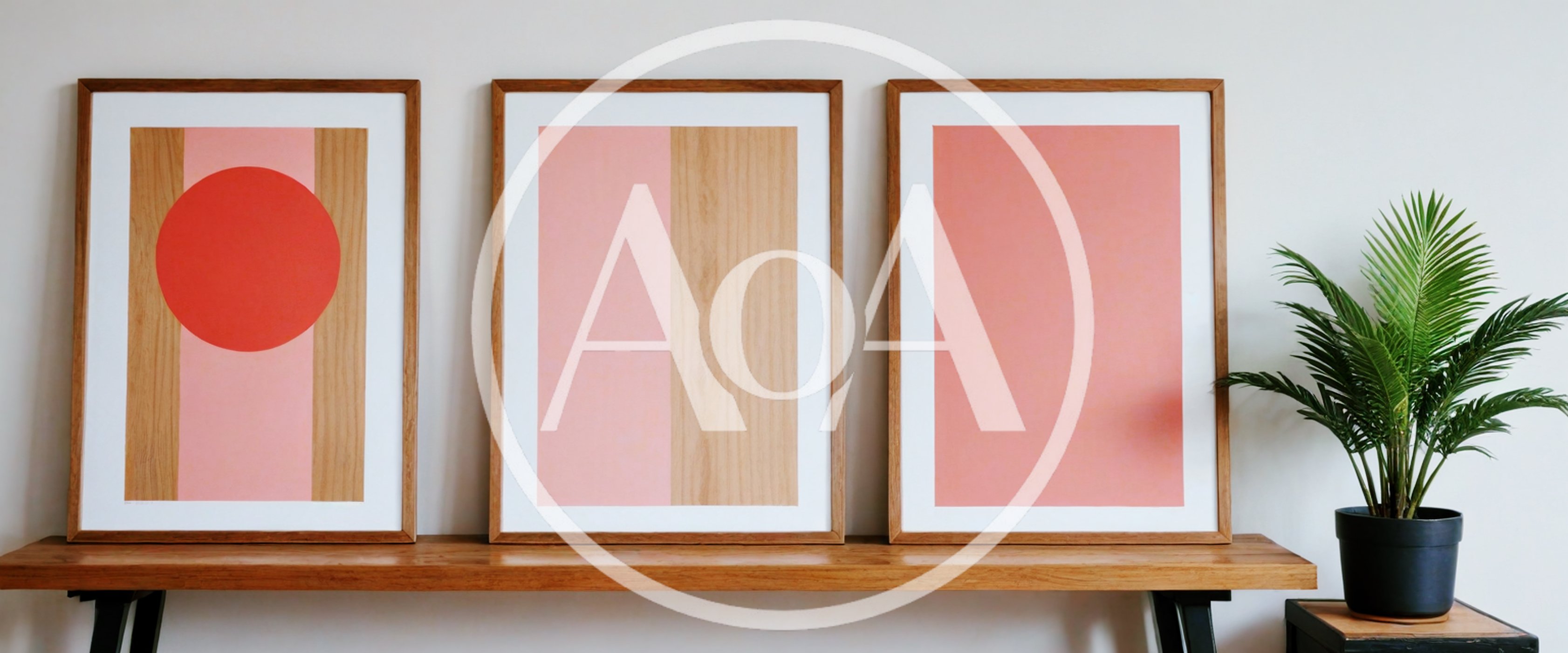 Three Minimalist Art Prints On A Wooden Console Table