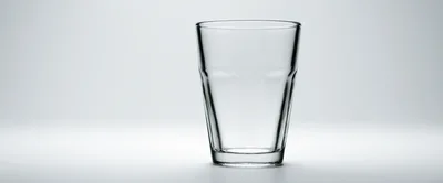 Empty Clear Glass Tumbler On White Background