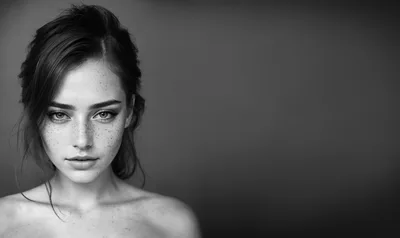 Portrait Of A Young Woman With Freckles