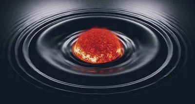 Glowing Sun Sphere Creating Ripples In Dark Liquid