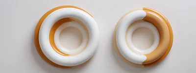 Two Abstract Glossy Torus Shapes On White Background