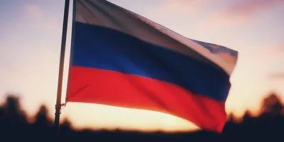 Russian Flag Waving Against A Sunset Sky