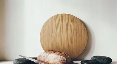 Artisan Sourdough Bread Loaf With Knife And Stones