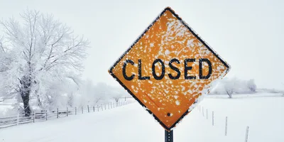 Closed Road Sign In Snowy Winter Landscape