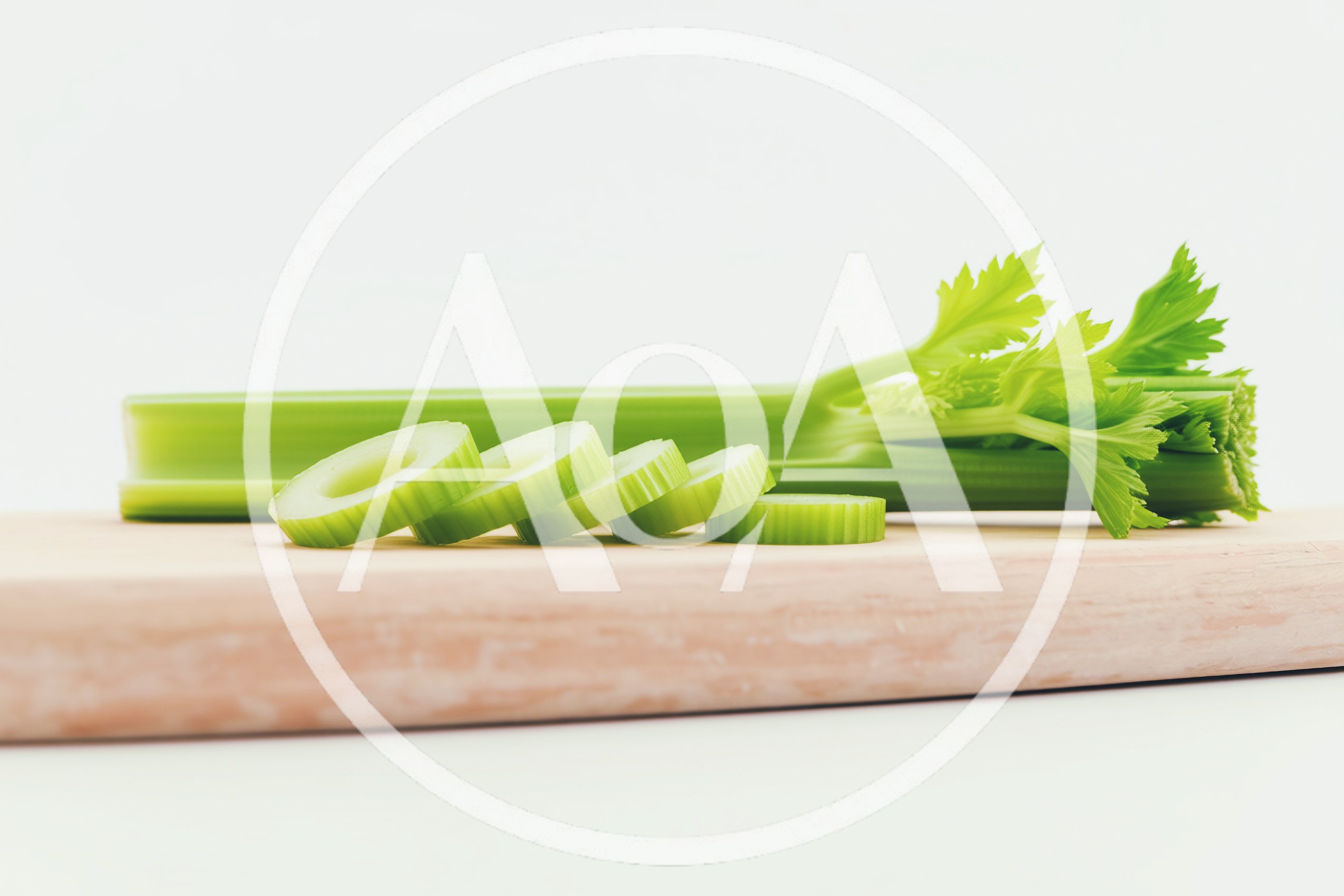 Fresh Celery Stalks Sliced on a Wooden Cutting Board