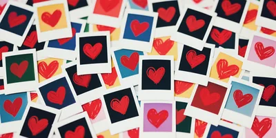 Collection of Scattered Polaroid Photos with Hand-Drawn Hearts