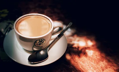 Cup Of Coffee With A Spoon On A Table