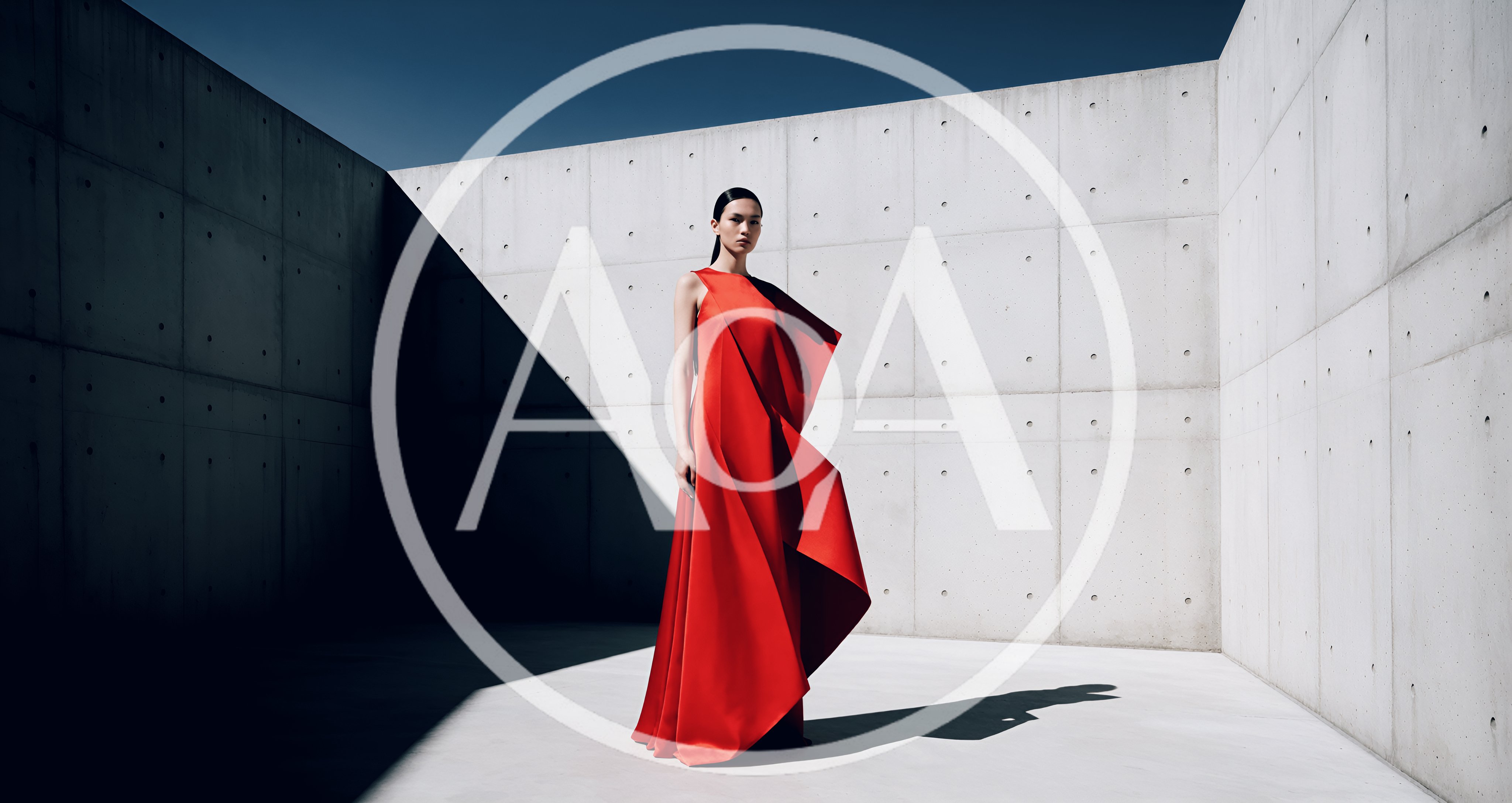 Fashion Model In Red Dress Against Concrete Wall
