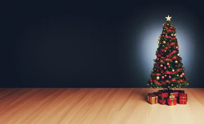 Decorated Christmas Tree With Gift Boxes On Wooden Floor