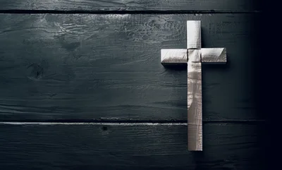 Silver Cross On Dark Wooden Background