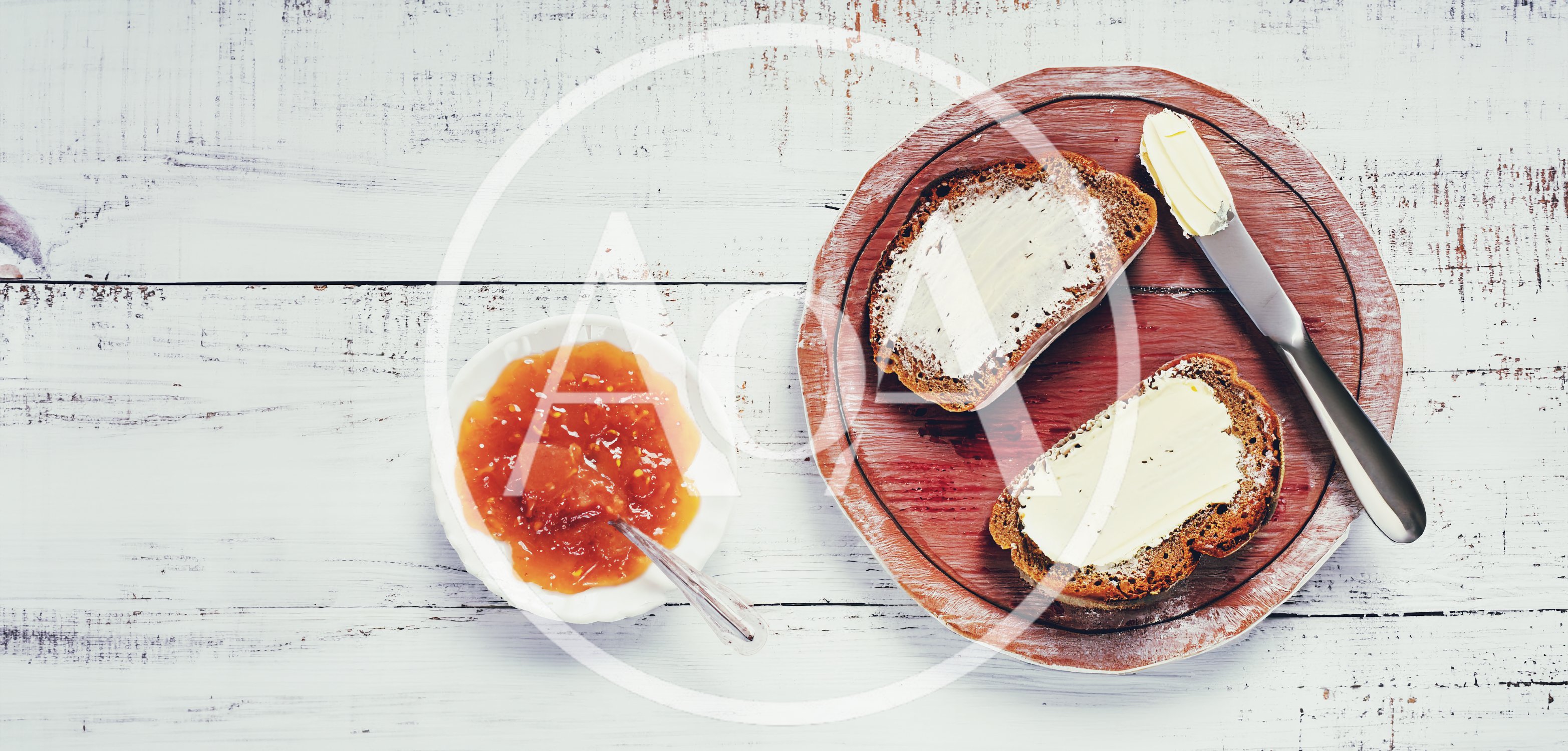 Two Slices Of Buttered Bread With Apricot Jam