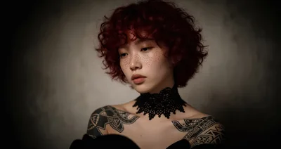 Portrait Of A Young Woman With Red Curly Hair