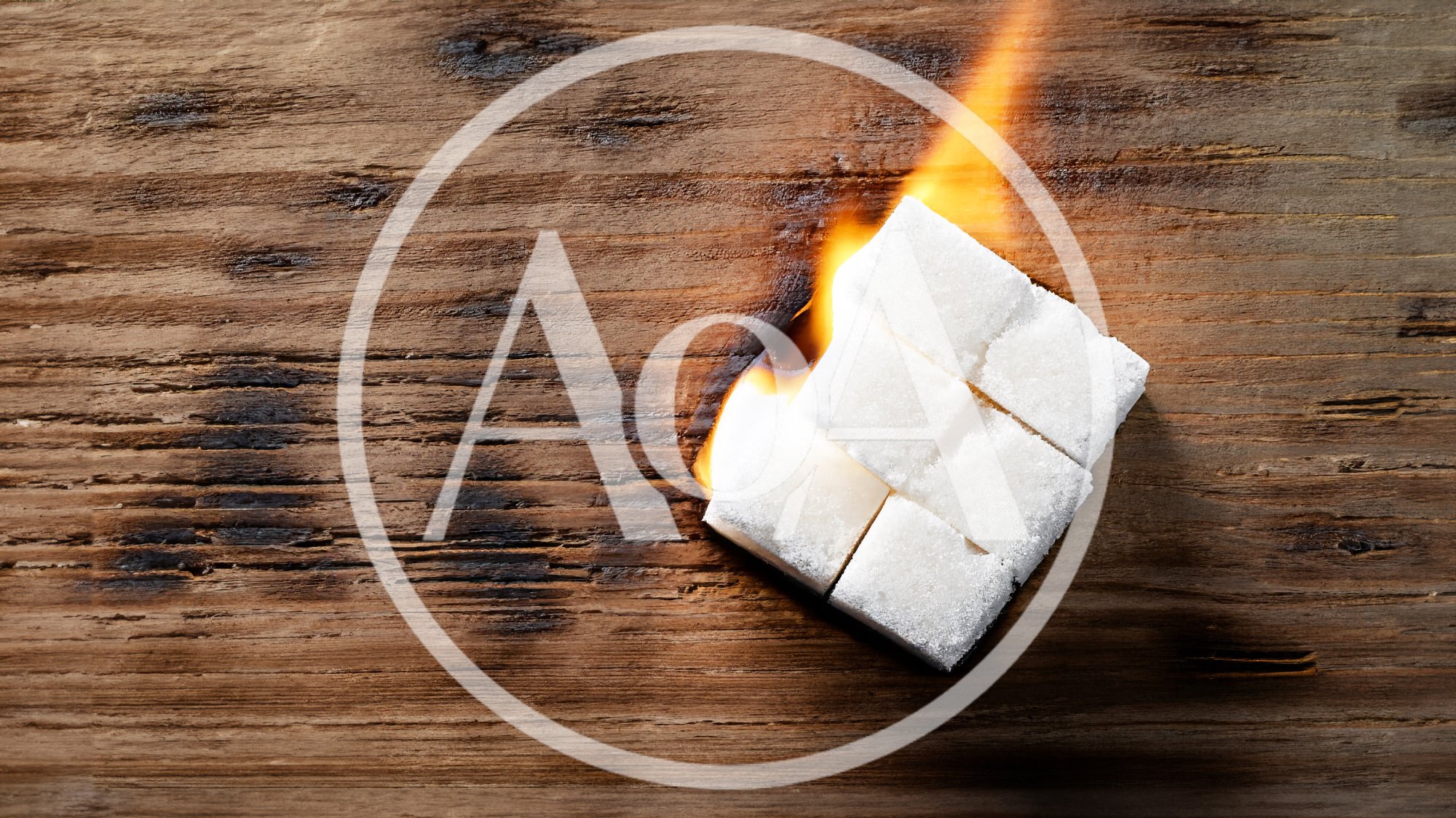 Sugar Cubes Burning on a Rustic Wooden Surface