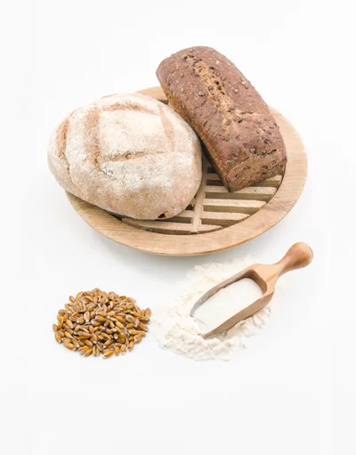 Artisan Bread Loaves With Wheat Grains And Flour
