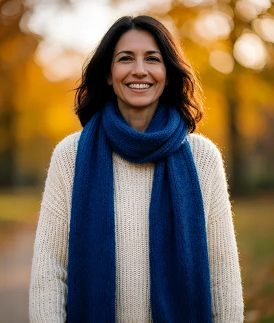 Smiling Woman Wearing Blue Scarf In Autumn Park