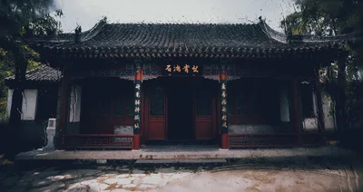 Traditional Chinese Temple Seen Through Rain Streaked Window