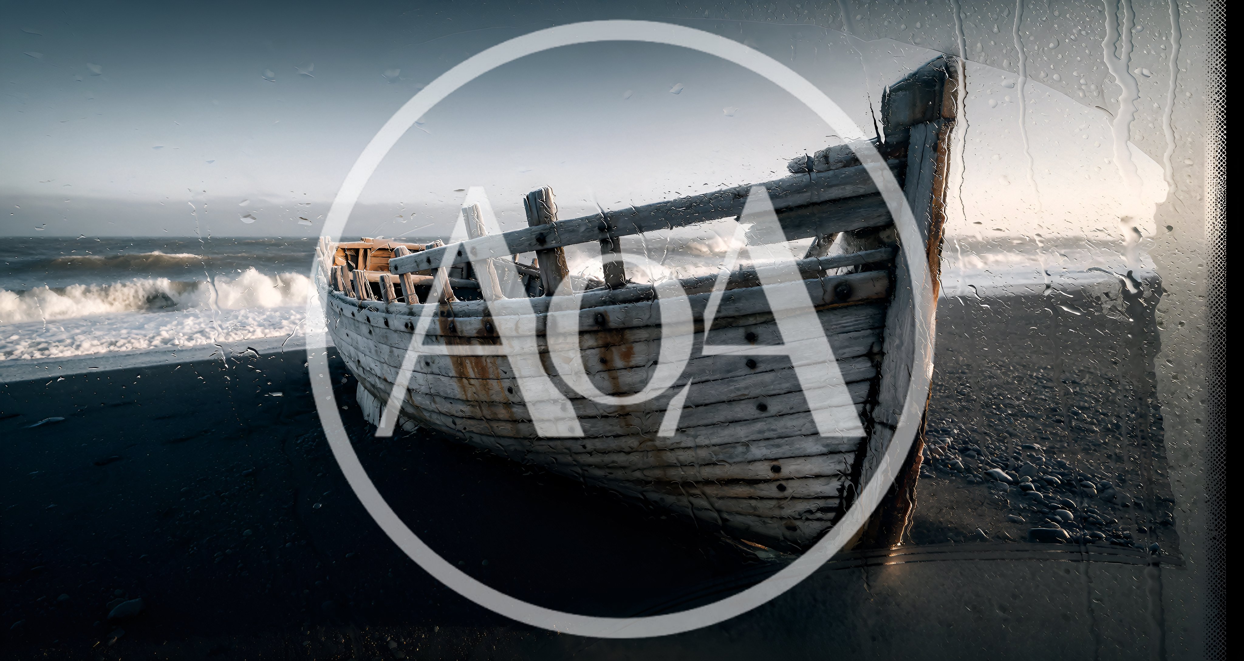 Weathered Wooden Boat Wreckage On A Dark Sand Beach
