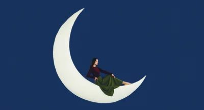 Woman Sitting On A Crescent Moon Prop