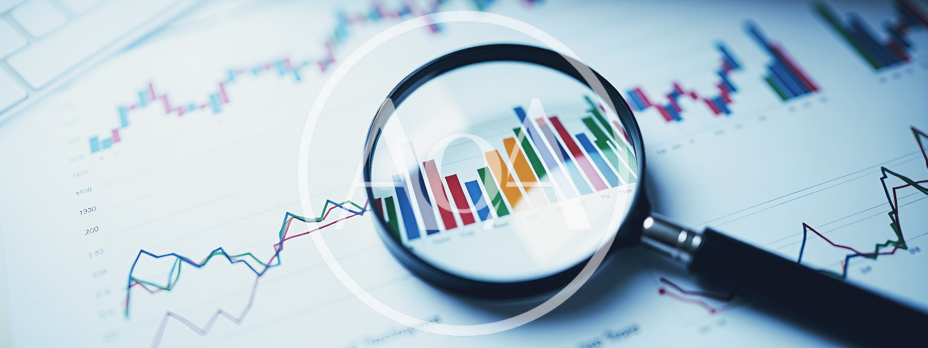 Magnifying Glass Over Financial Stock Market Charts