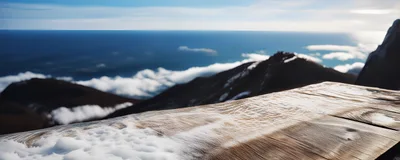 Snow Covered Wooden Table Overlooking Mountain Peaks