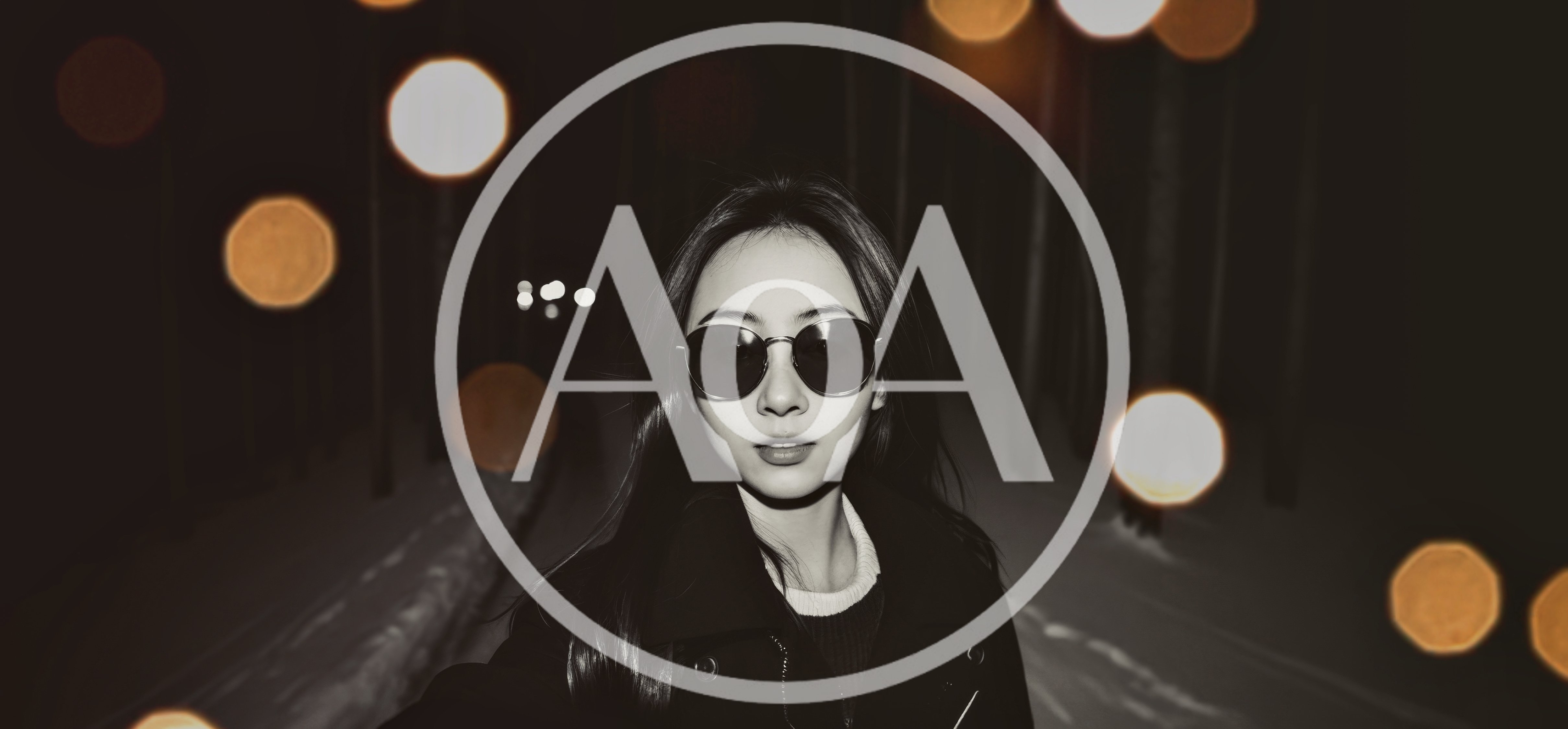 Young Woman Wearing Sunglasses In A Snowy Forest At Night
