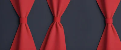 Three Red Curtains Tied Back Against Dark Background