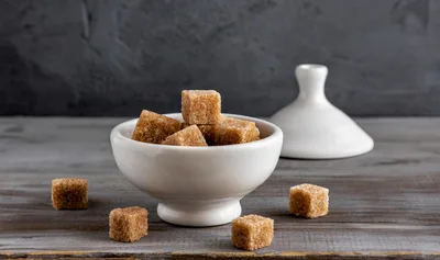 Brown Sugar Cubes in a White Ceramic Bowl