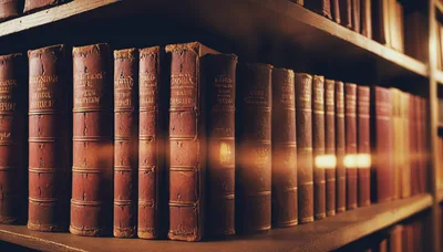 Antique Leather Bound Books On A Library Shelf