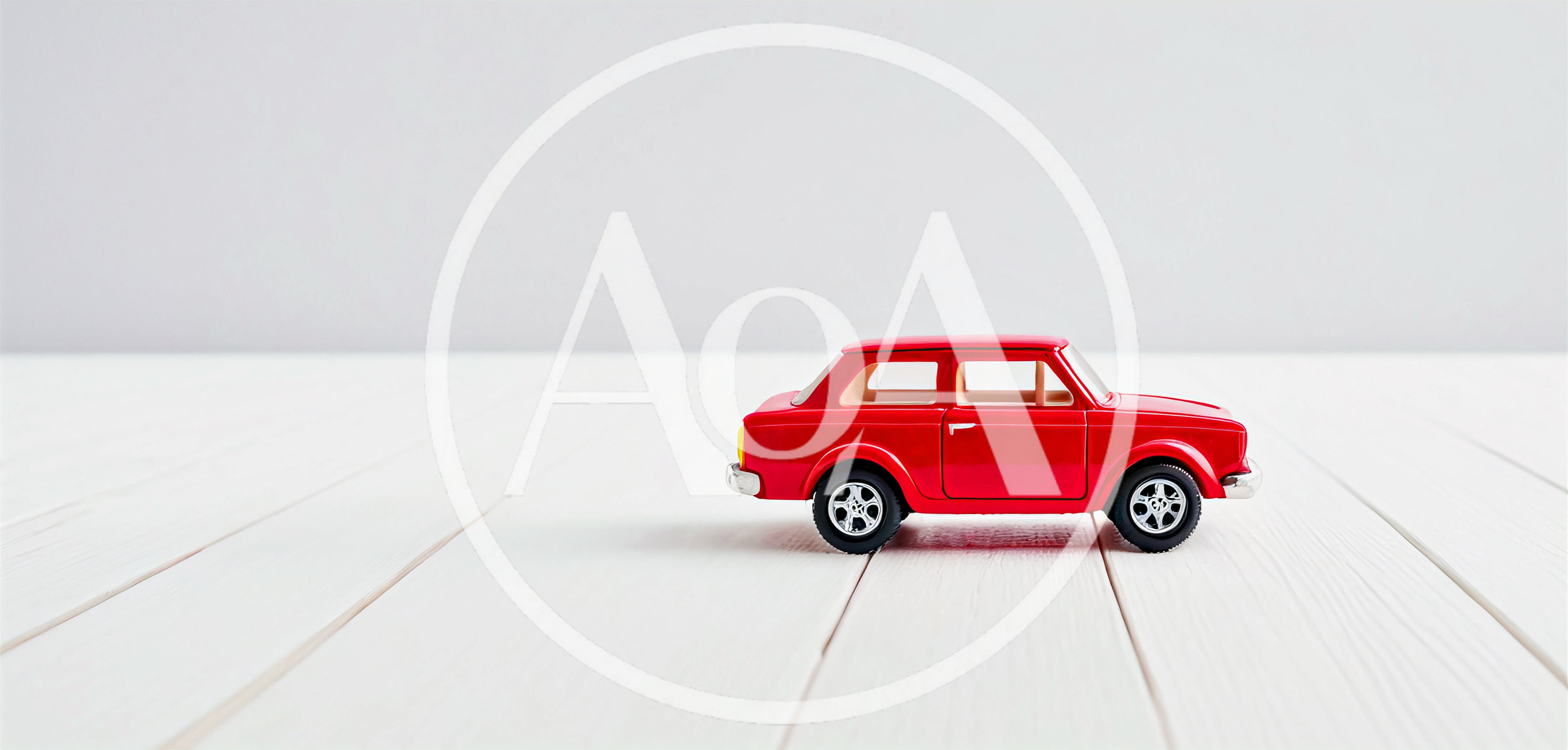 Red Toy Car On White Wooden Surface