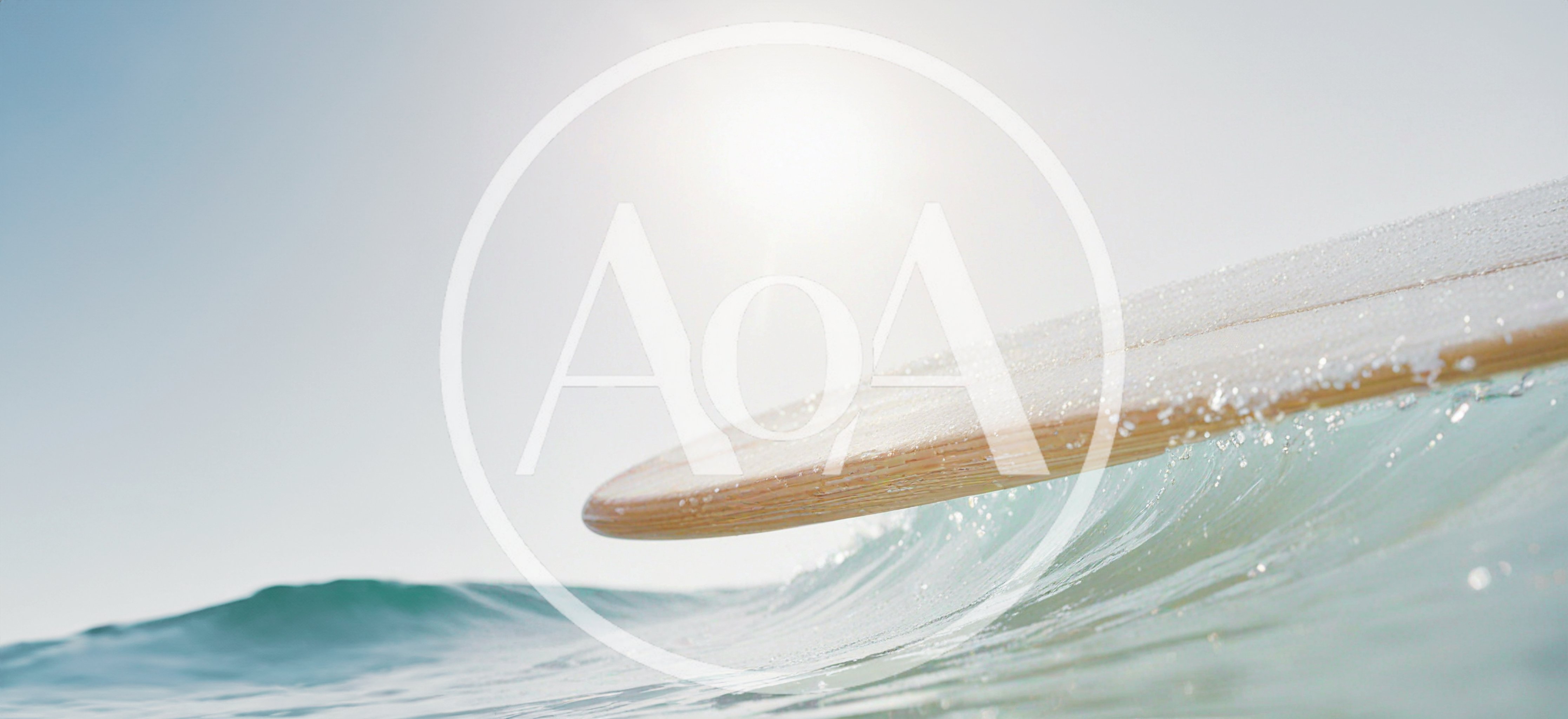 Wooden Surfboard Gliding Over A Breaking Ocean Wave