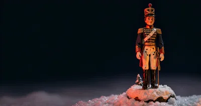 Toy Soldier Figurine Standing On Snowy Ground