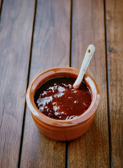 Ceramic Pot Of Fig Jam With A Spoon