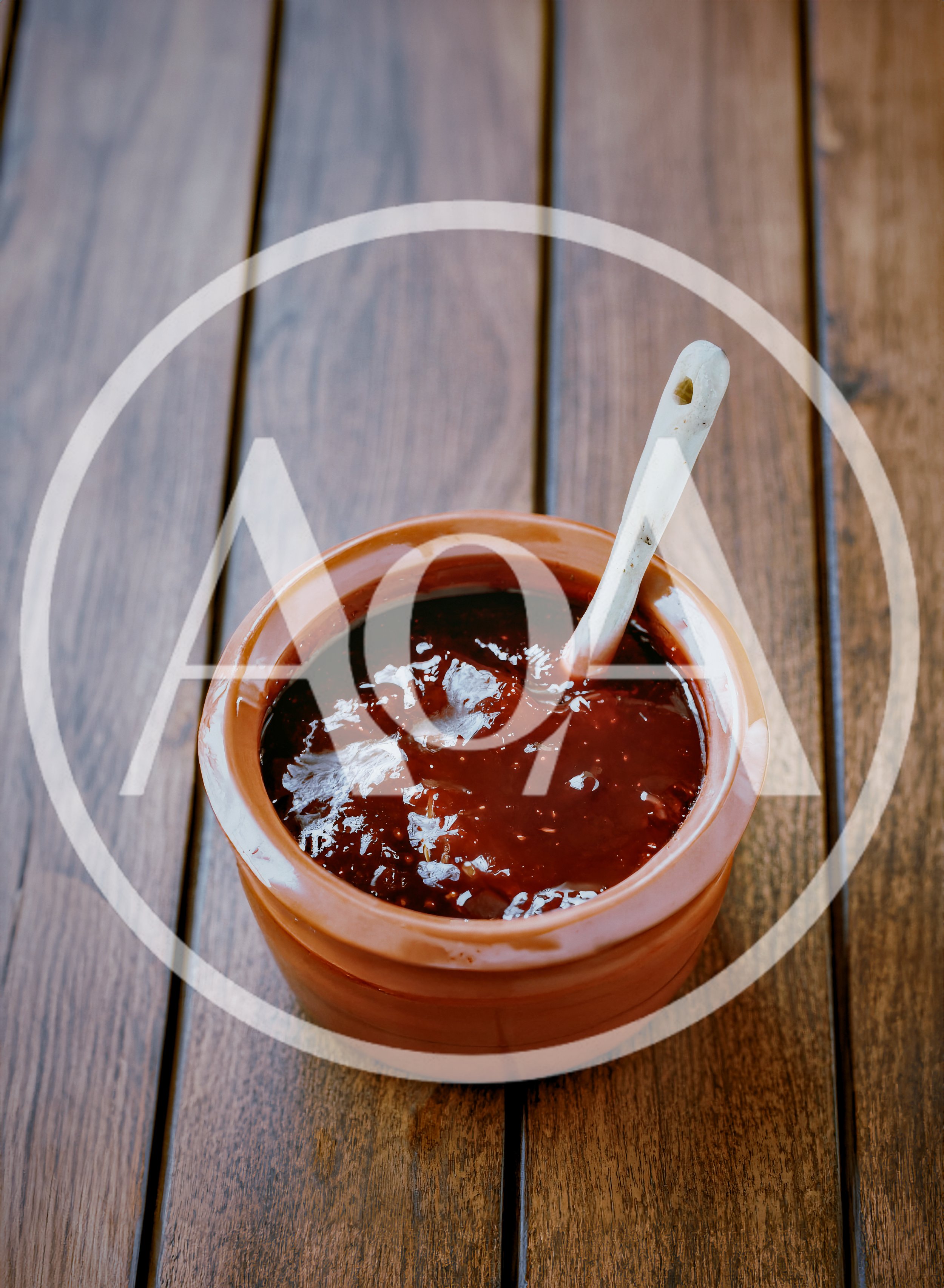 Ceramic Pot Of Fig Jam With A Spoon