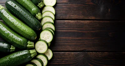 Fresh Green Zucchini Vegetables on Dark Wooden Table