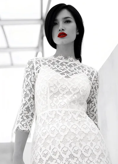Fashion Portrait Of A Woman In A White Lace Dress