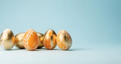 Golden Easter Eggs With Citrus Texture On Blue Background