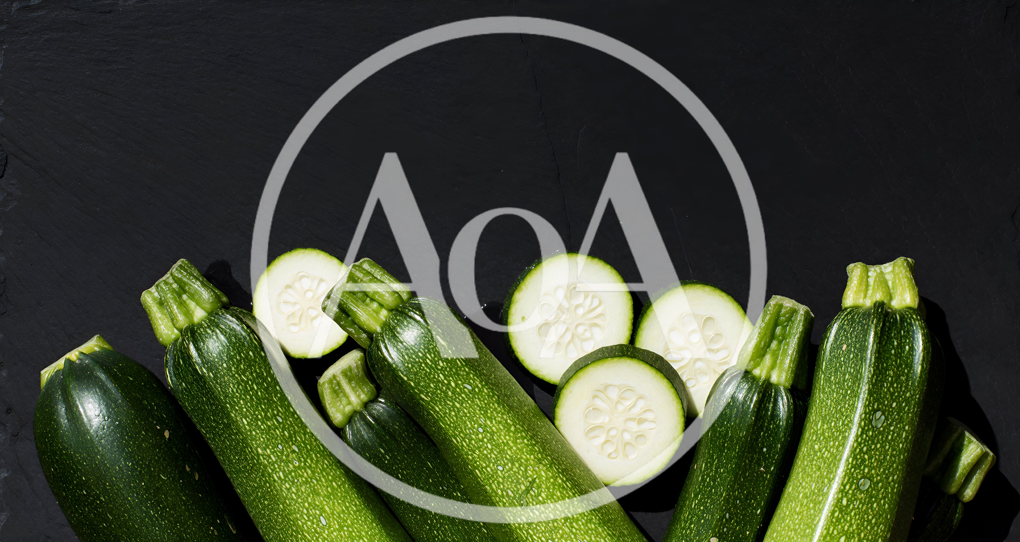 Fresh Green Zucchini Squash on Black Slate Background
