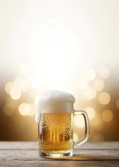 Glass Mug Of Cold Beer With Frothy Foam