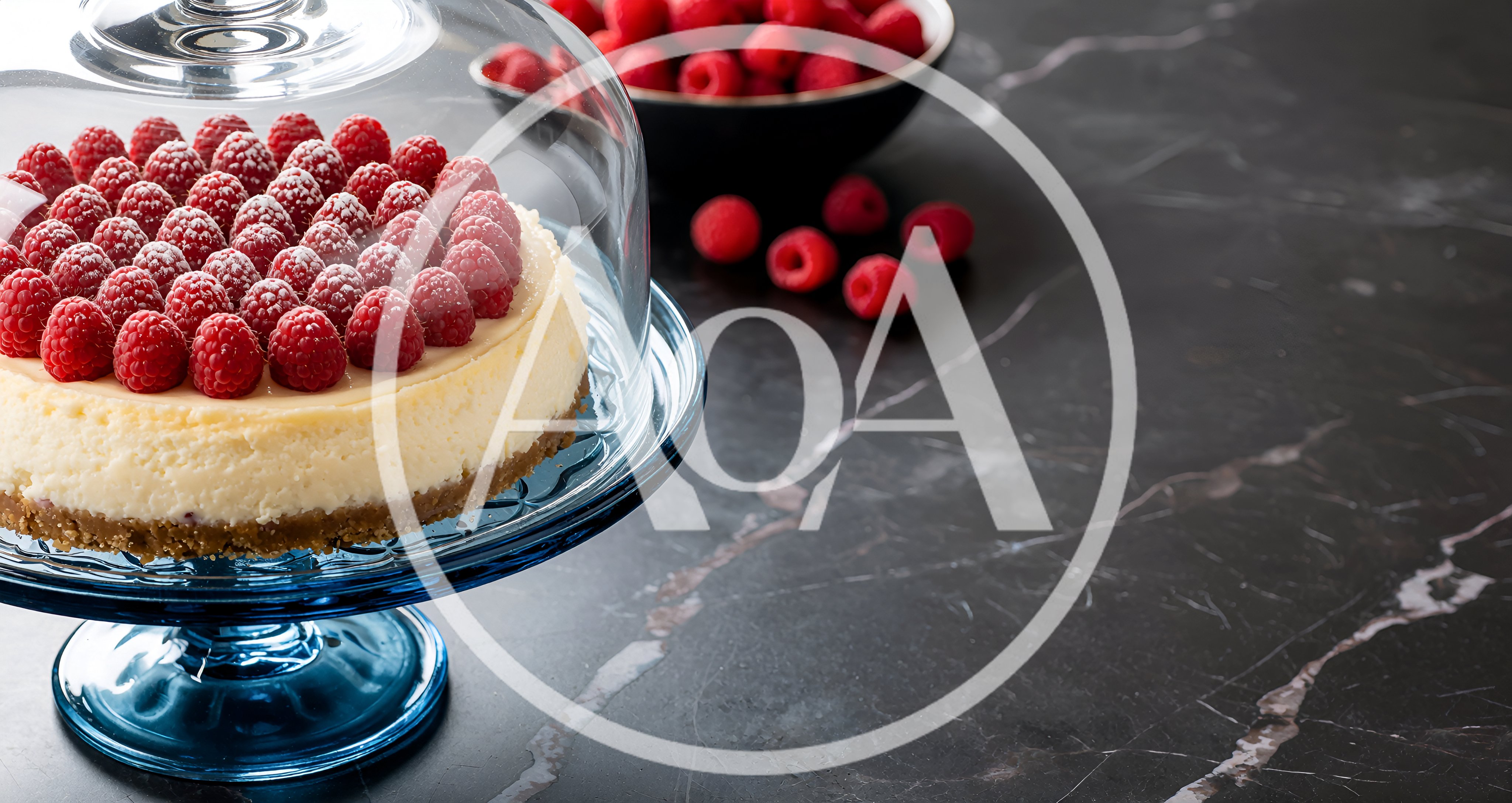 Cheesecake Topped With Fresh Raspberries Under Glass Dome