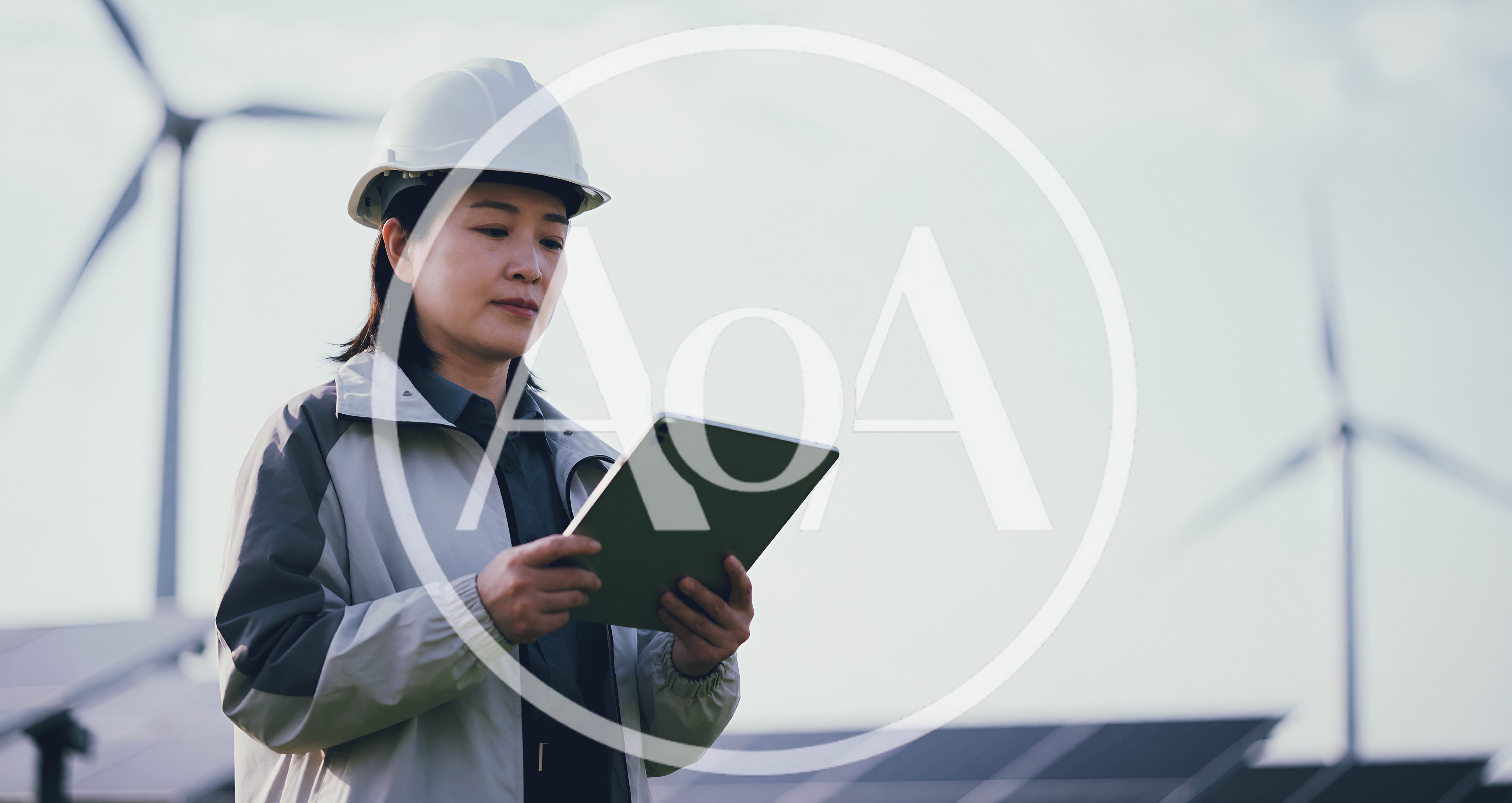 Female Engineer Inspecting Solar Farm With Tablet