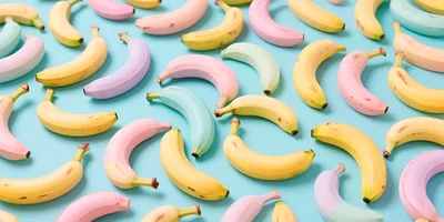 Pastel Colored Bananas Pattern on Blue Background