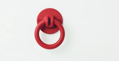 Red Circular Door Knocker On White Background
