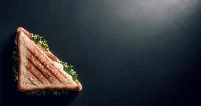 Grilled Ham and Cheese Sandwich on Dark Background