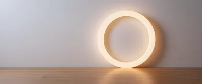 Glowing Circular Neon Light On Wooden Floor