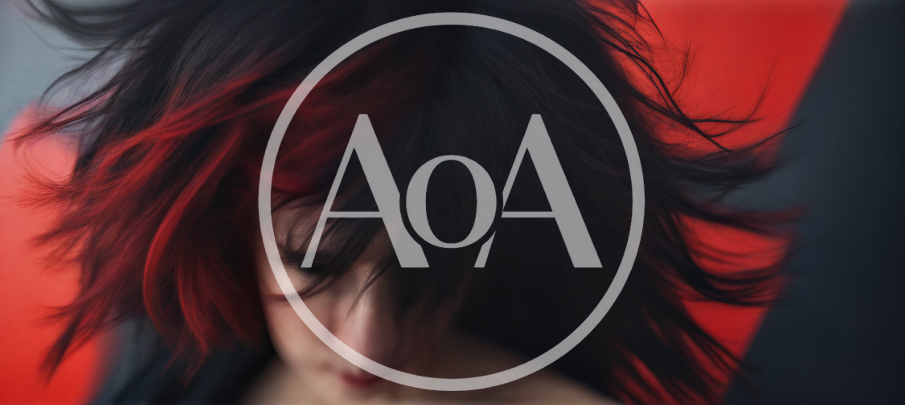 Woman With Red And Black Hair Flipping Her Head