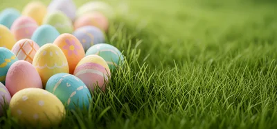Colorful Easter Eggs Scattered On Green Grass