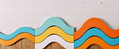Colorful Wavy Wooden Blocks Arranged On A Surface