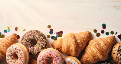 Assorted Donuts and Croissants with Colorful Confetti