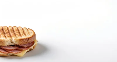 Grilled Ham and Cheese Sandwich on White Background