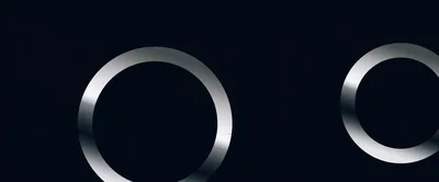 Abstract Metallic Rings On Dark Background